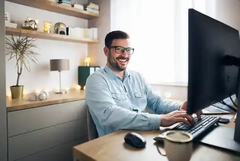 home-office-setup-service-compressed a man working from a home office setup