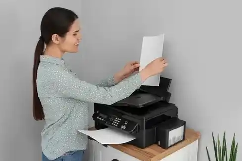 home-printer-setup-service-compressed Woman set up a home printer for a customer